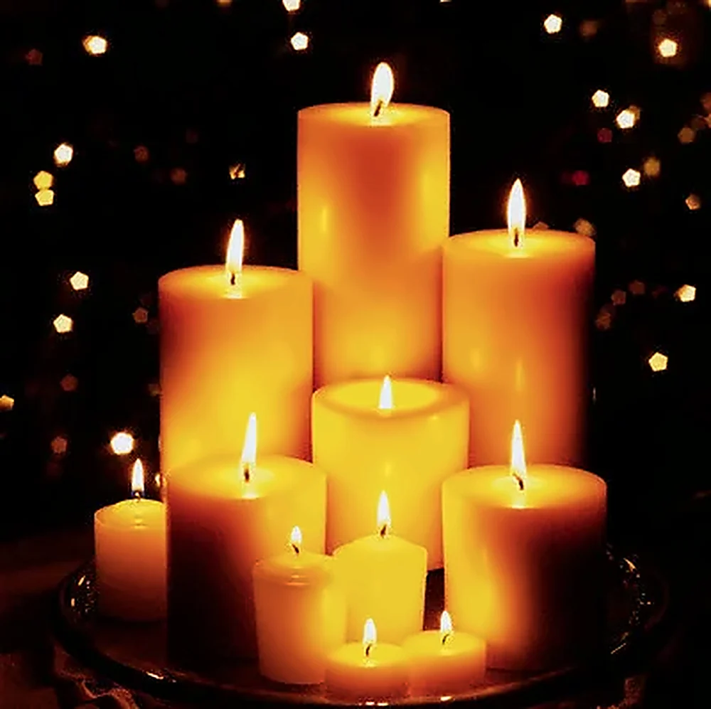 Candles glowing in a darkened room