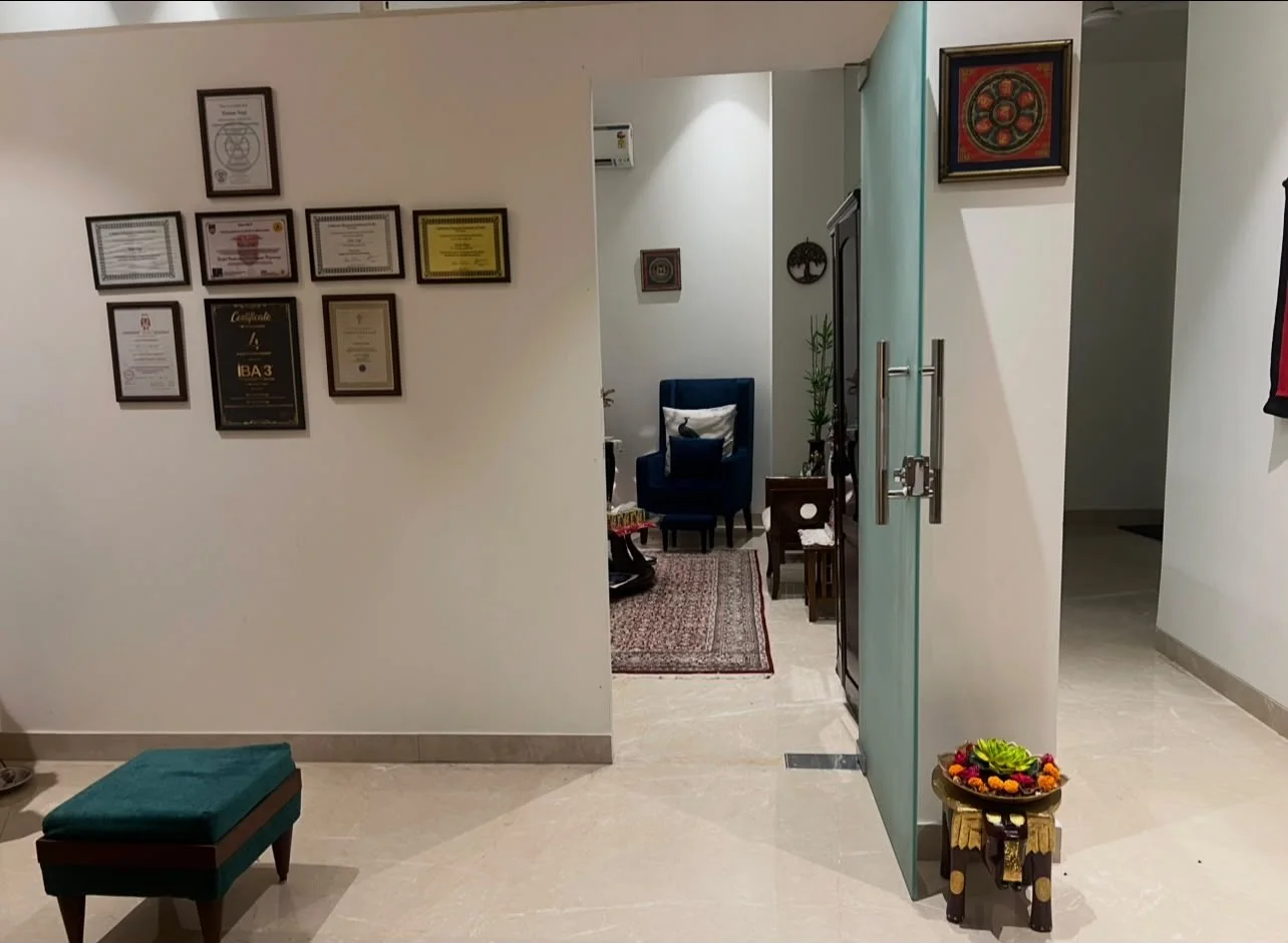 The hallway at Holistic Healing Centre, with Taanya’s framed certificates and a view into the consultation room